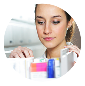 Woman looking in pill drawer